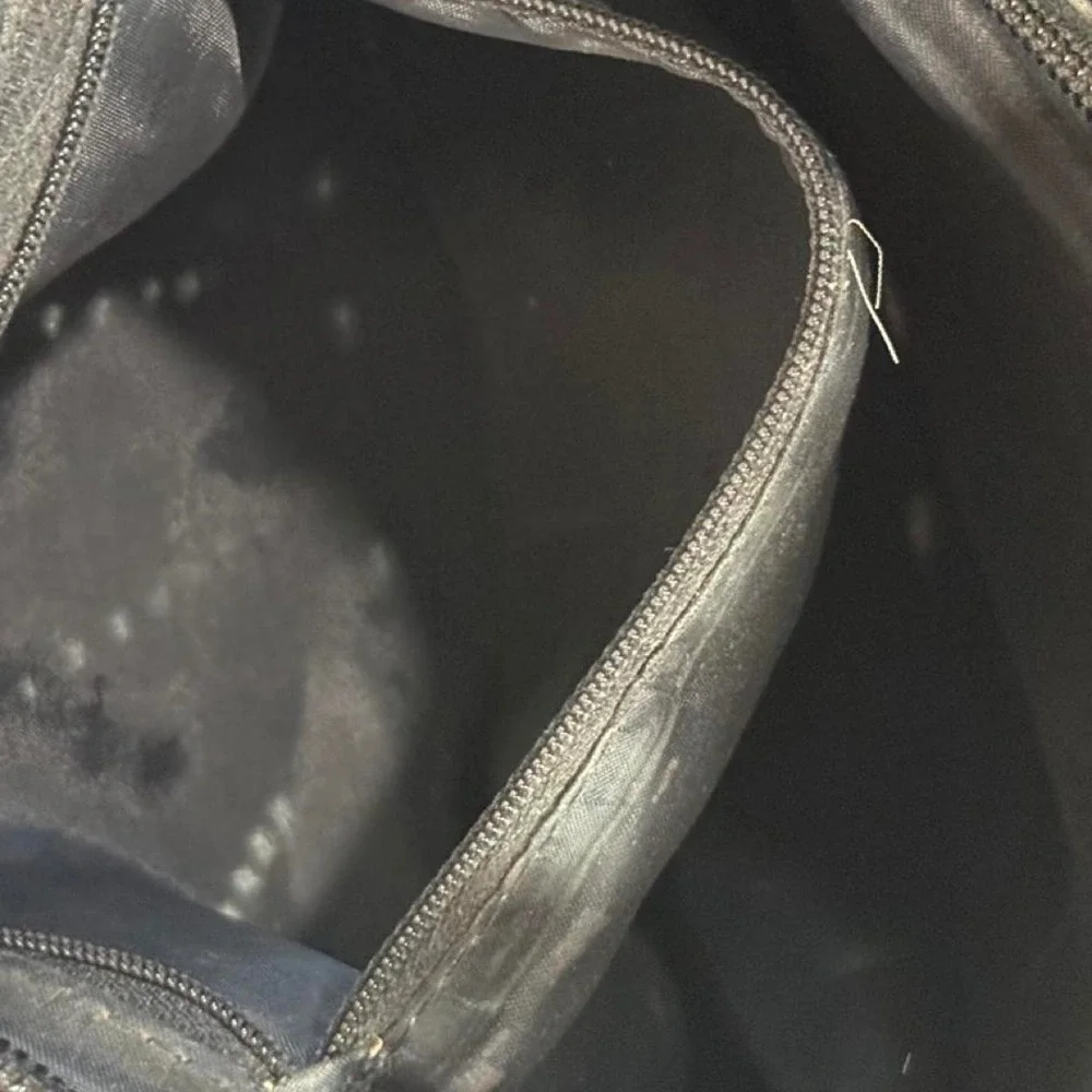 Black woven leather shoulder bag with strap